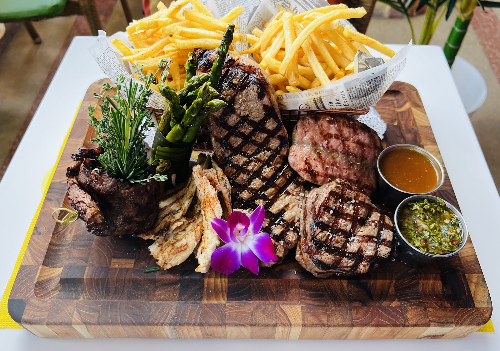 Grilled meats with fries and sauces